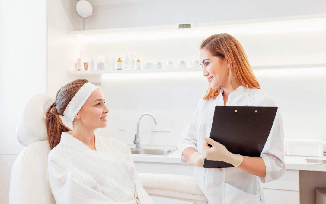 A spa consultant talking to a patient about informed data.